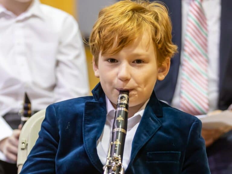 A boy playing the clarinet