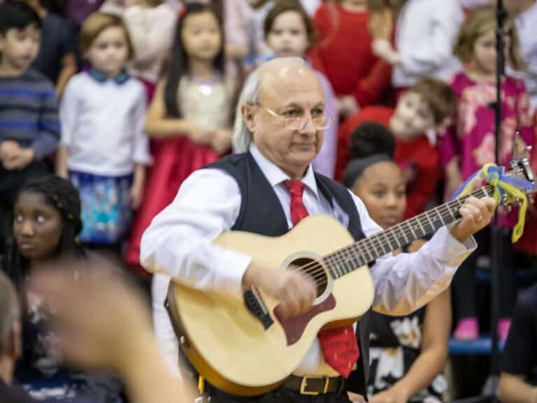 Music teacher performs with students