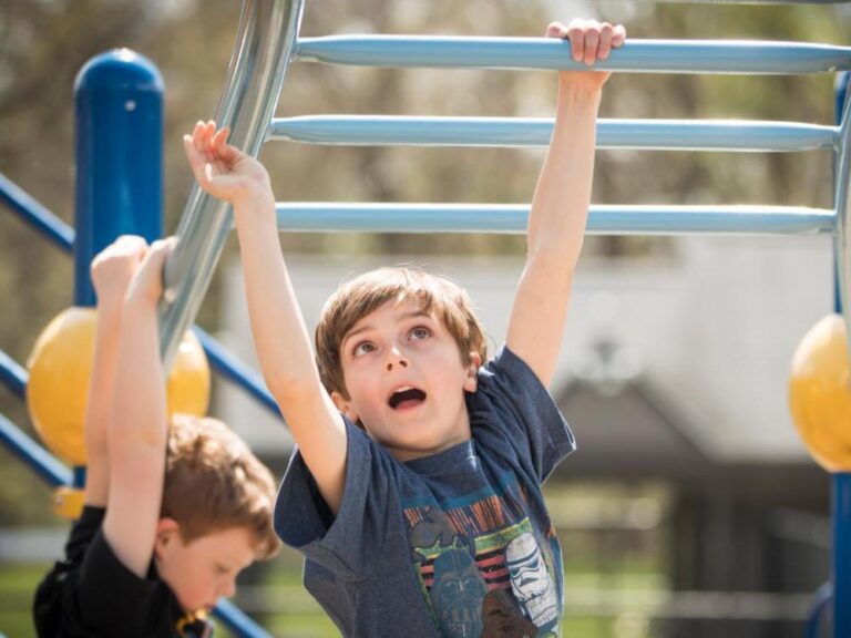 boy on climbing frame