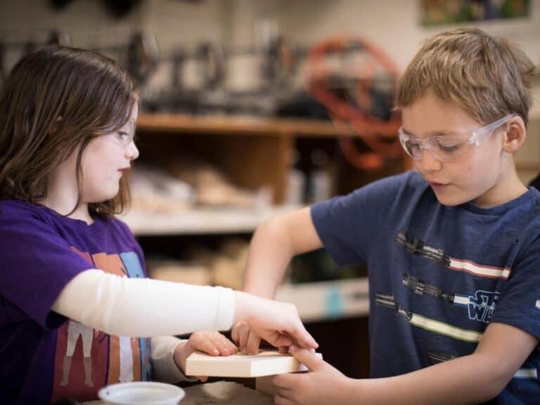 Boy and girl in woodworking class