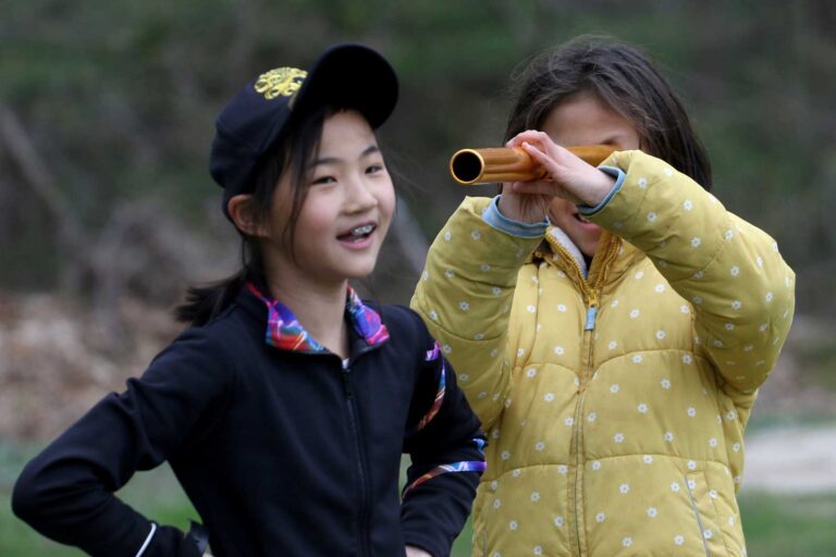 Two students outdoors playing I-Spy