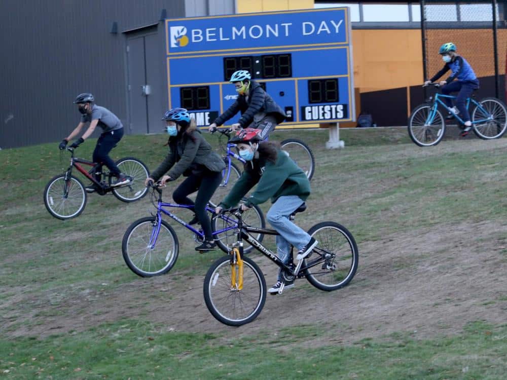 Several students take off on their trail bikes