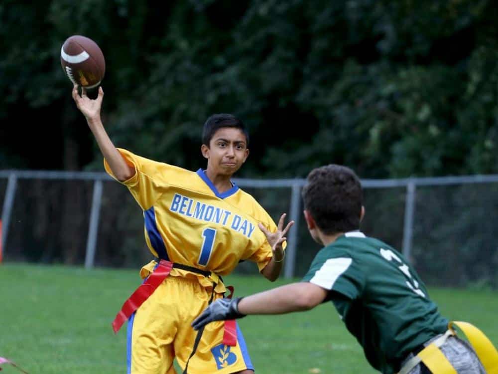 Flag Football boy throwing football