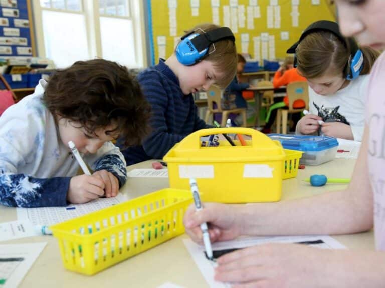 A small group of students works on a writing project