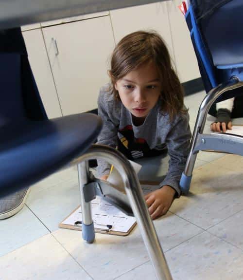 A boy works on a hands-on math activity