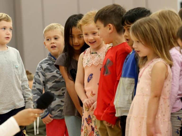 Kindergarteners at sharing assembly