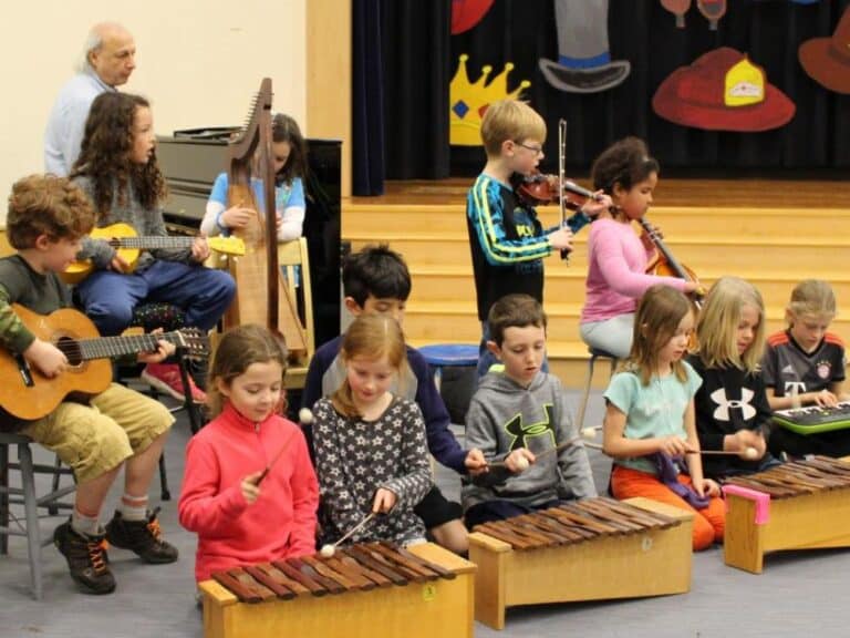 Weekly music classes emphasize expressive singing, appreciation of master compsers’ works, and Orff instruments. Every first grader performs an instrumental overture and sings as part of the chorus in a musical play.