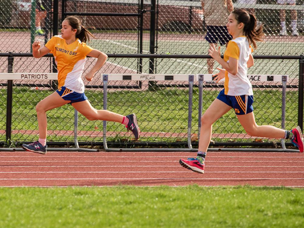 Two girls running a race