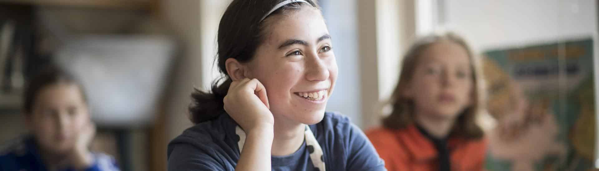 Smiling student in class