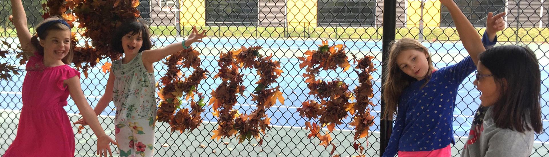 Students with their fall leaf design