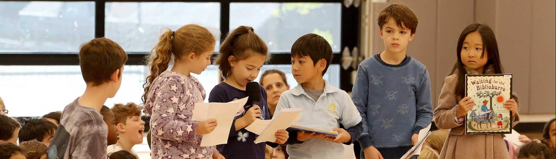 First graders present at Sharing Assembly
