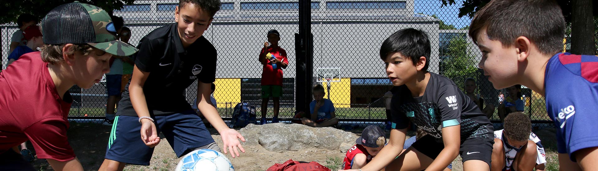 Four campers play Four Square