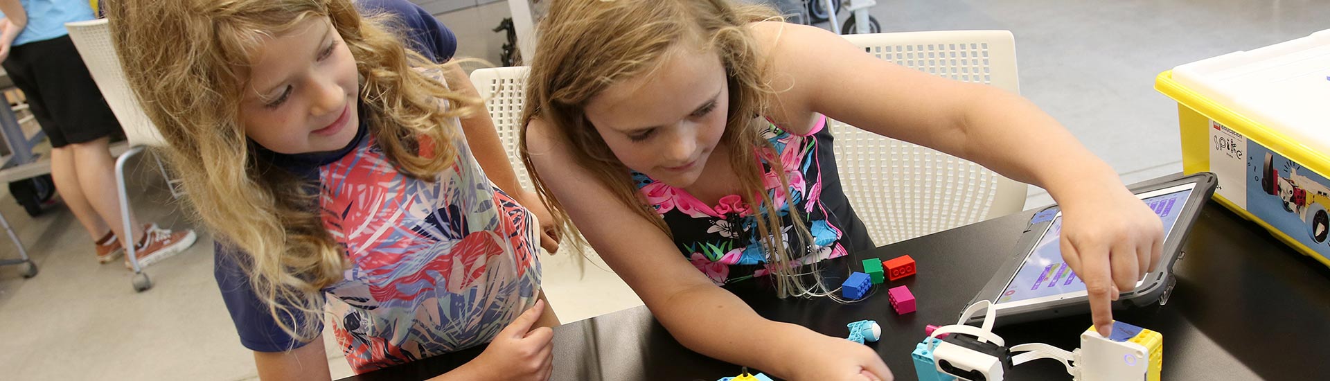 Two campers work on programming in STEM camp