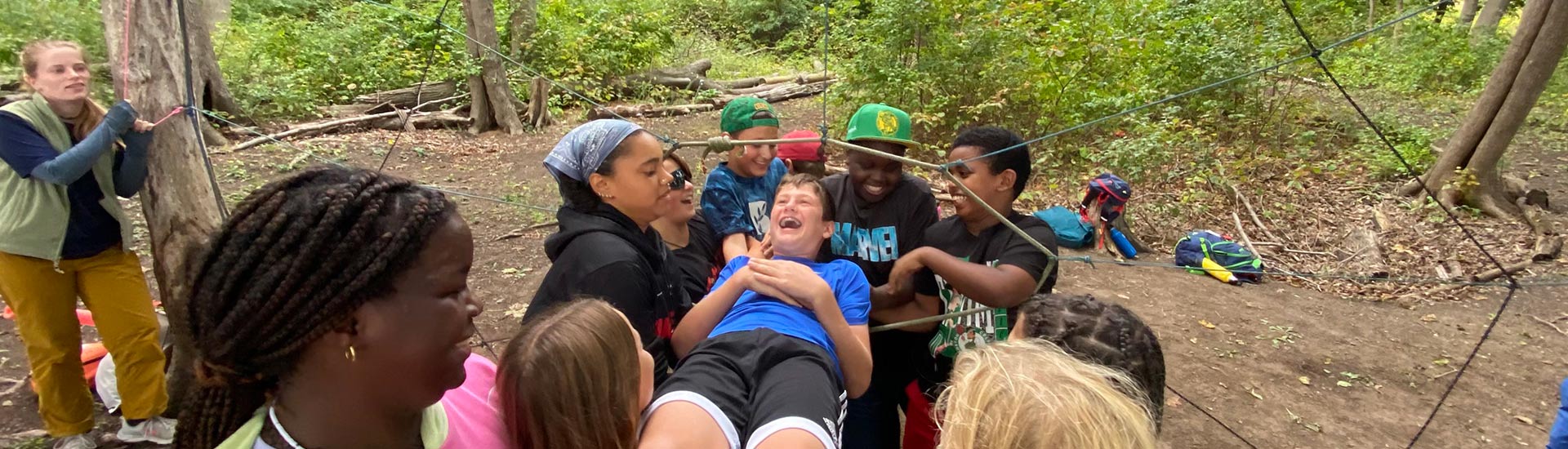 A group of sixth graders bond during an Outward Bound activity