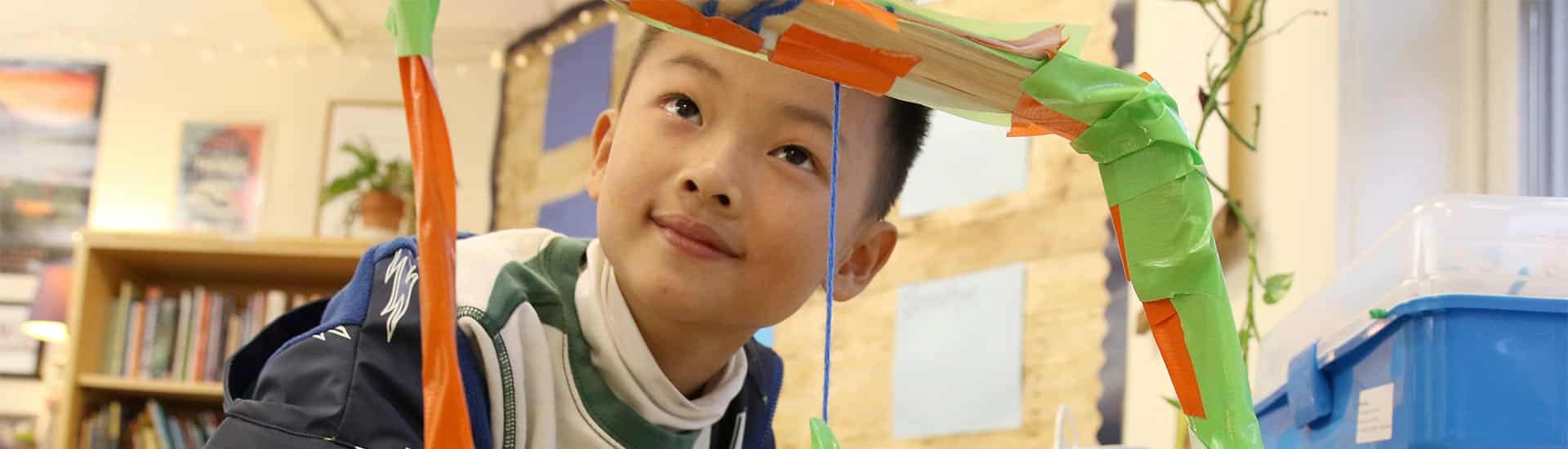 A third grader constructs an unique contraption in Innovation class