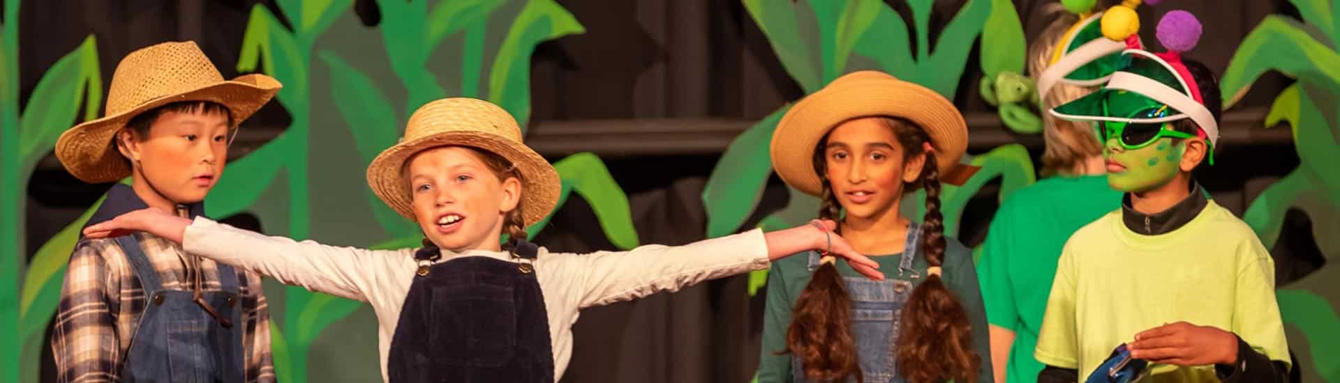 Third graders on stage during their class play performance