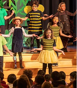 Students on stage for the third grade play