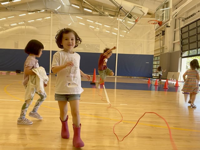 Pre-k students dash and hop in PE class