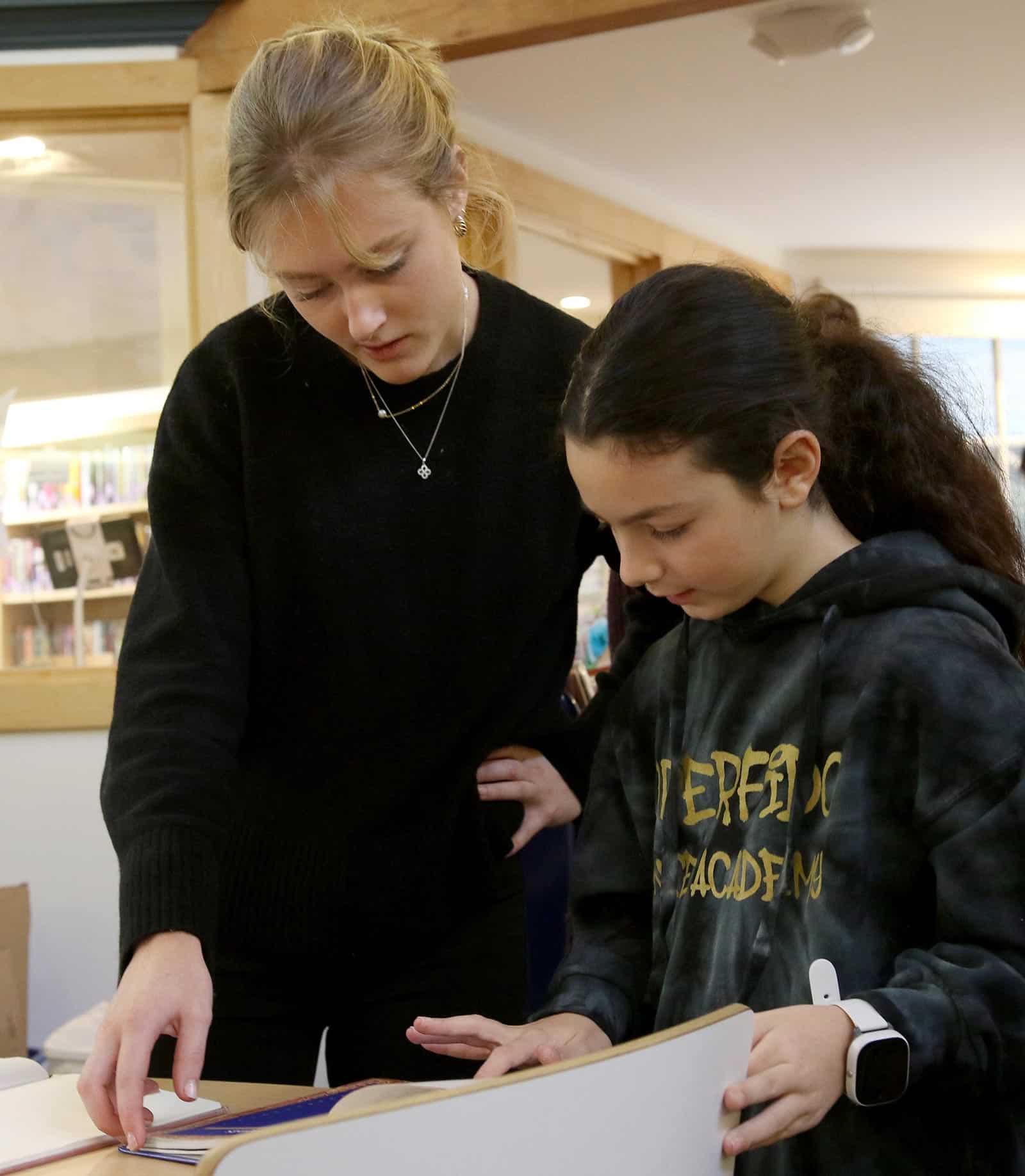 Isabel Moore '16 works with a student during her practicum in fourth grade