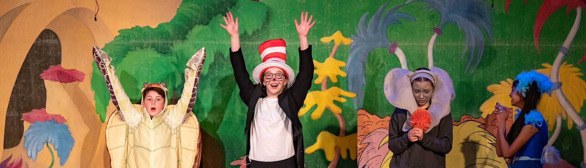 Students on stage performing Seussical JR.