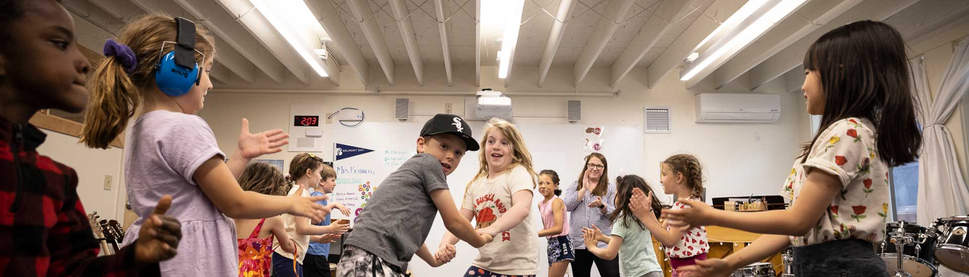 Students in music class dance and sing