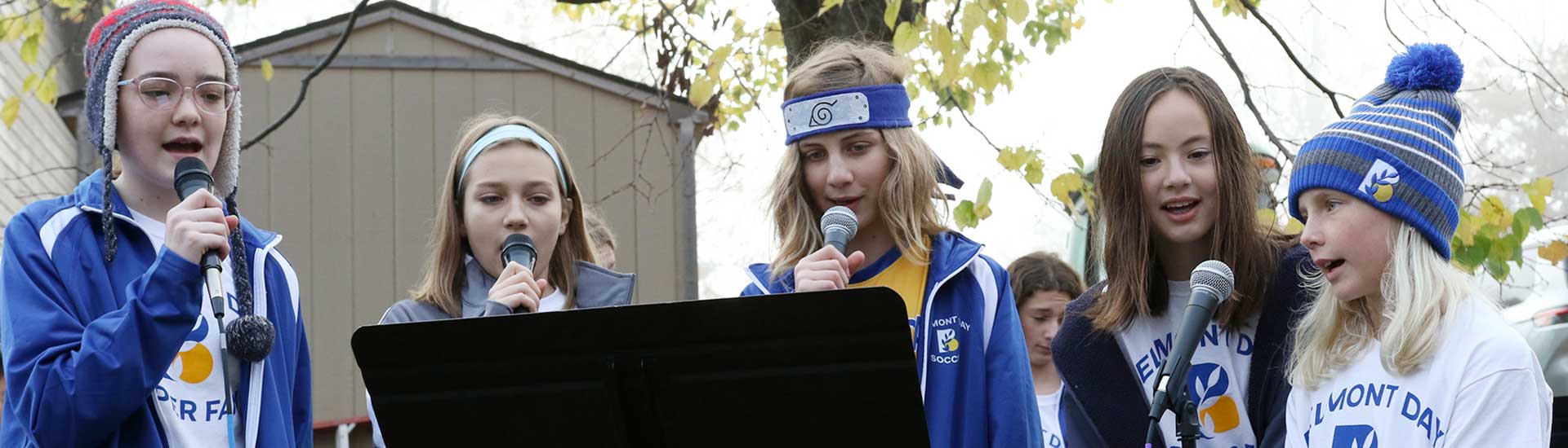 Student musicians perform outdoors at the Spirit Day parade