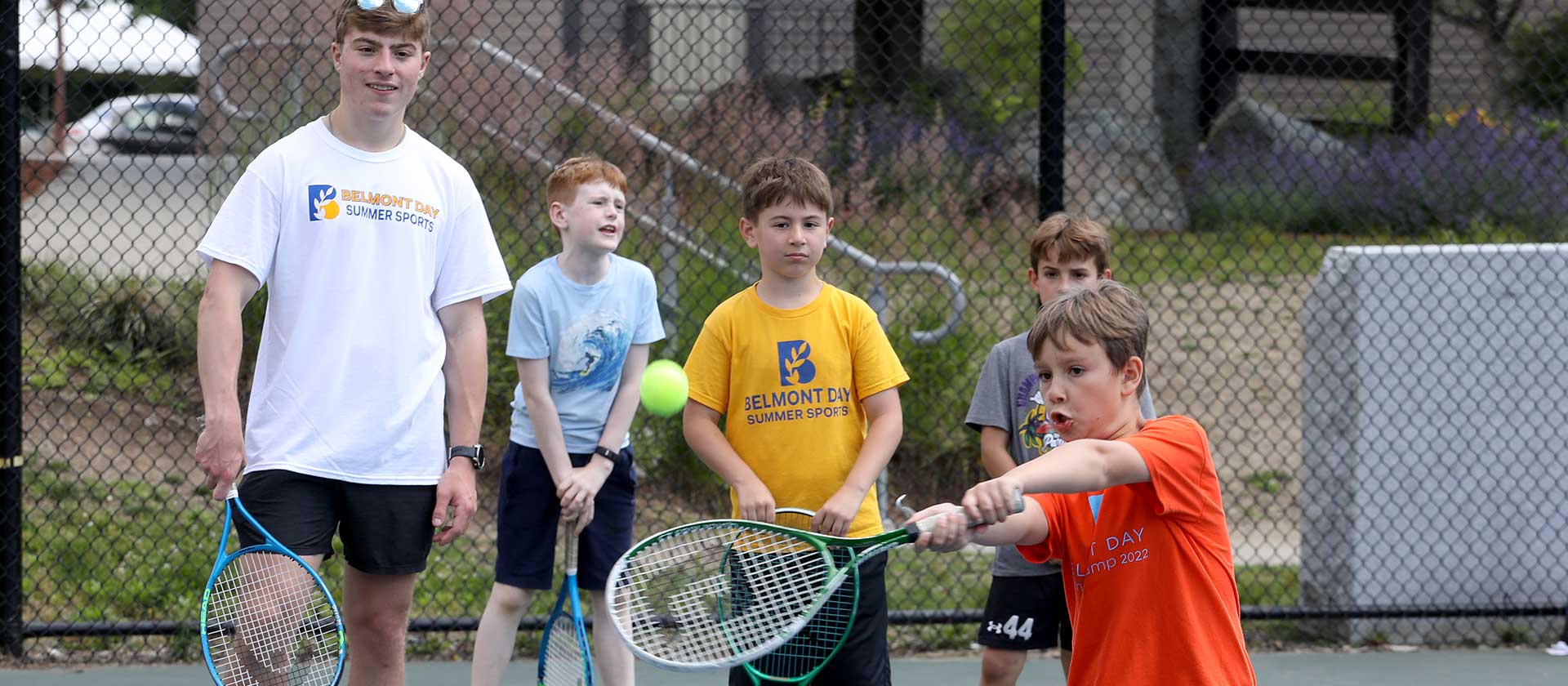 A camper ties a two-handed back stroke during sports camp