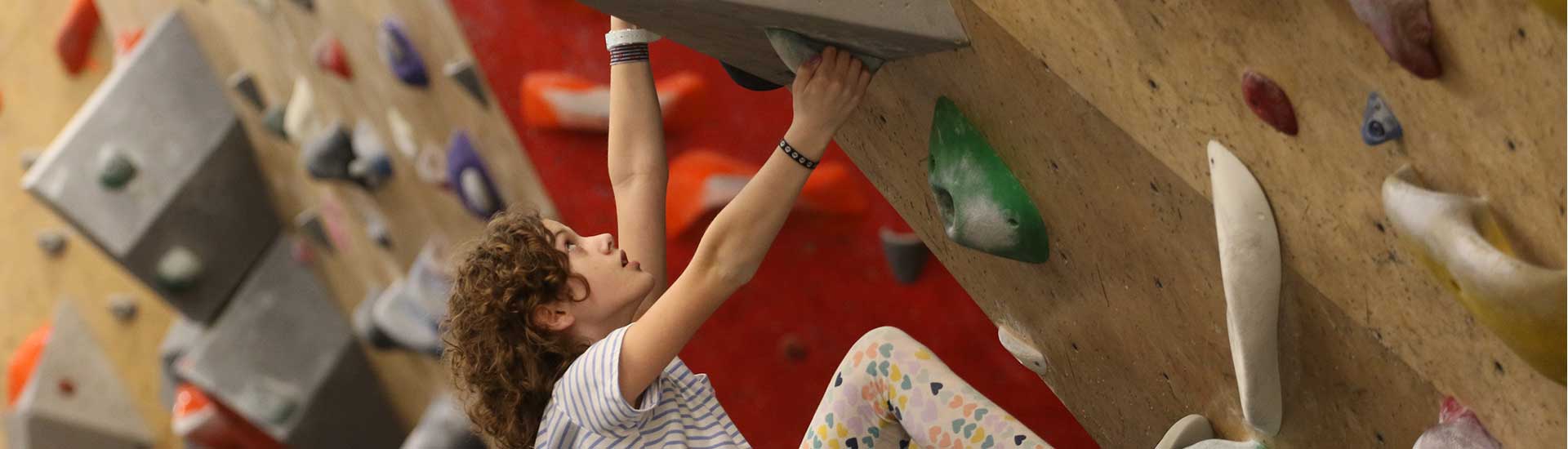 A student on the climbing wall