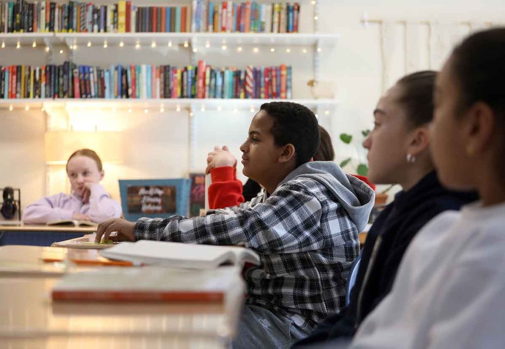 Students are focused on a discussion in English class